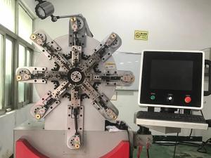 How to adjust the position of wire feeding wheel of multi axis spring machine?